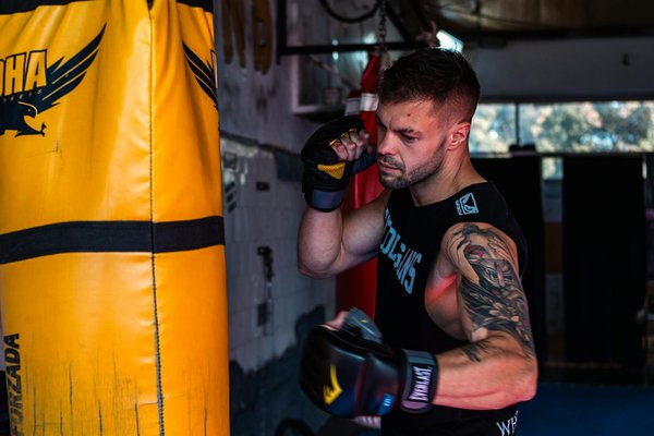 How can UK sports venues implement eco-friendly practices while maintaining functionality?